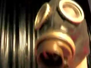 Seductress In A Gas Mask Uses A Vibrat.
